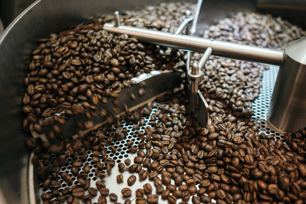 roasting coffee beans in a roaster